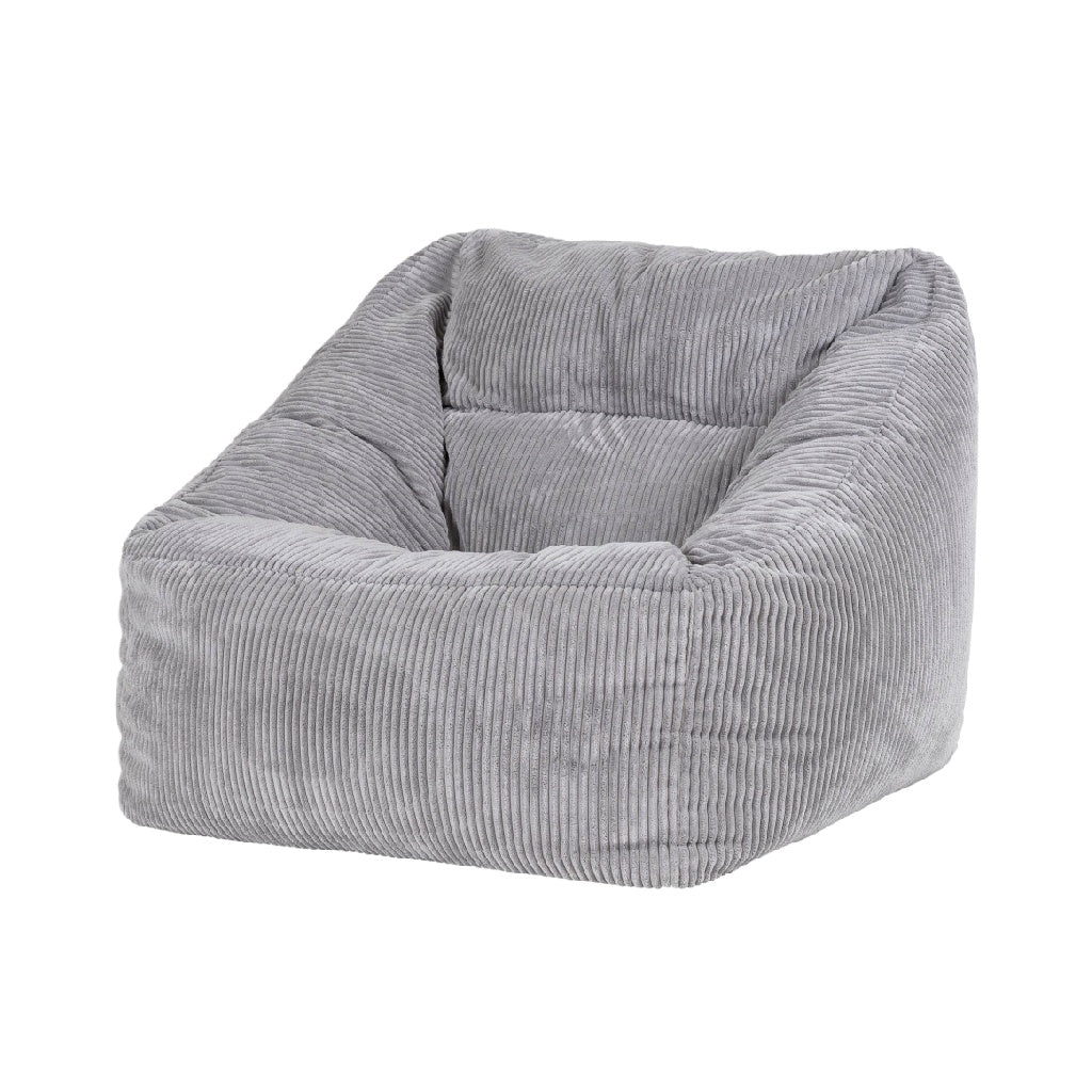 Sillón tipo puff tapizado en pana gris para interior