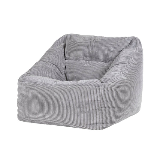 Sillón tipo puff tapizado en pana gris para interior